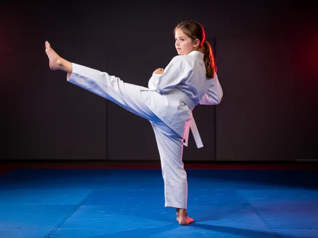 A child demonstrating the back kick