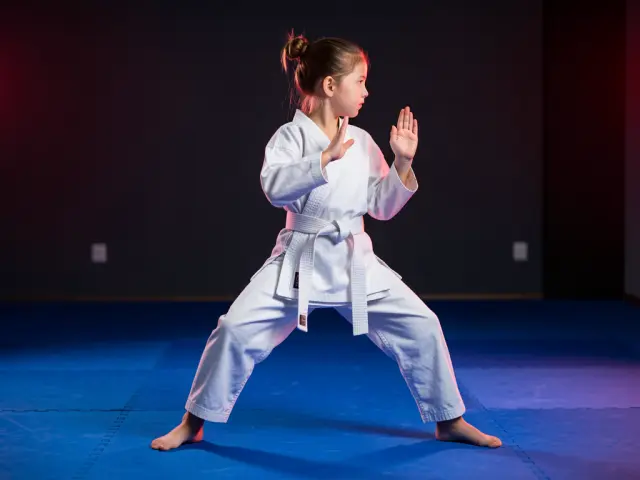 A child demonstrating the back stance