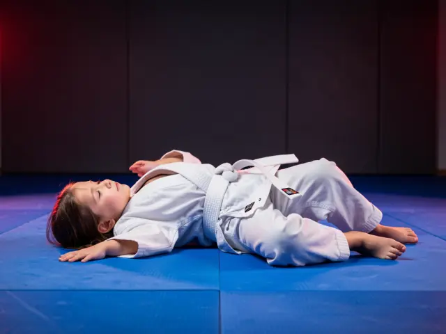 A child demonstrating the falling safely