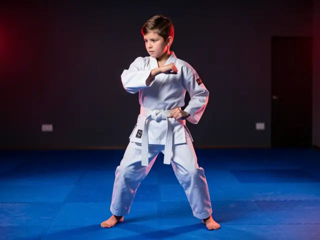 A child demonstrating the inside block
