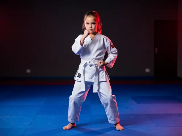 A child demonstrating the outside block