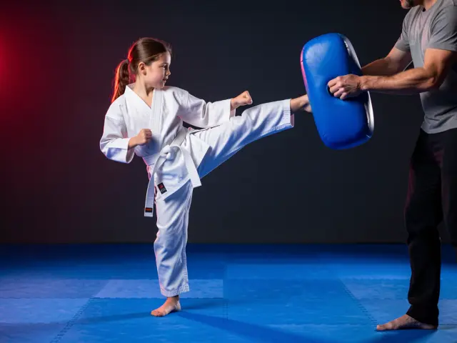 A child demonstrating the roundhouse kick
