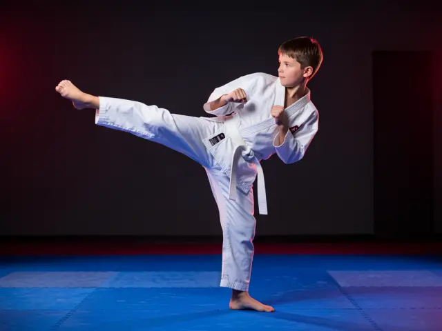 A child demonstrating the side kick