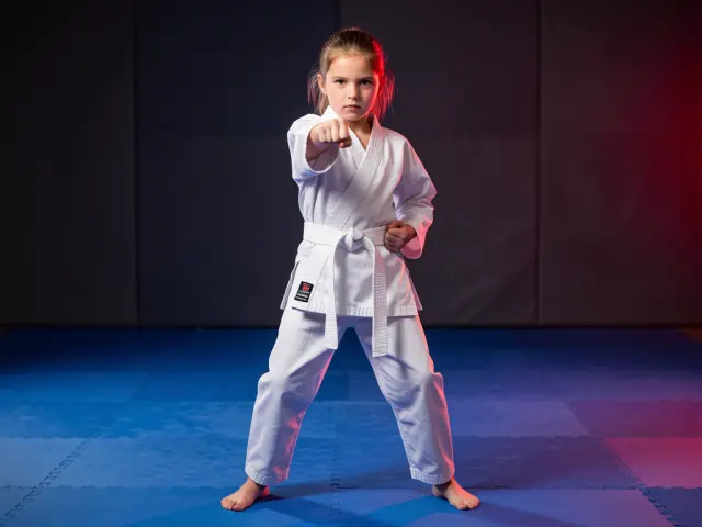 A child demonstrating the straight punch